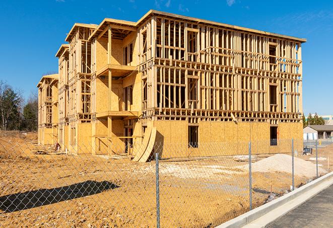 construction zone secured with a temporary fence, marked with warning signs in Pinole